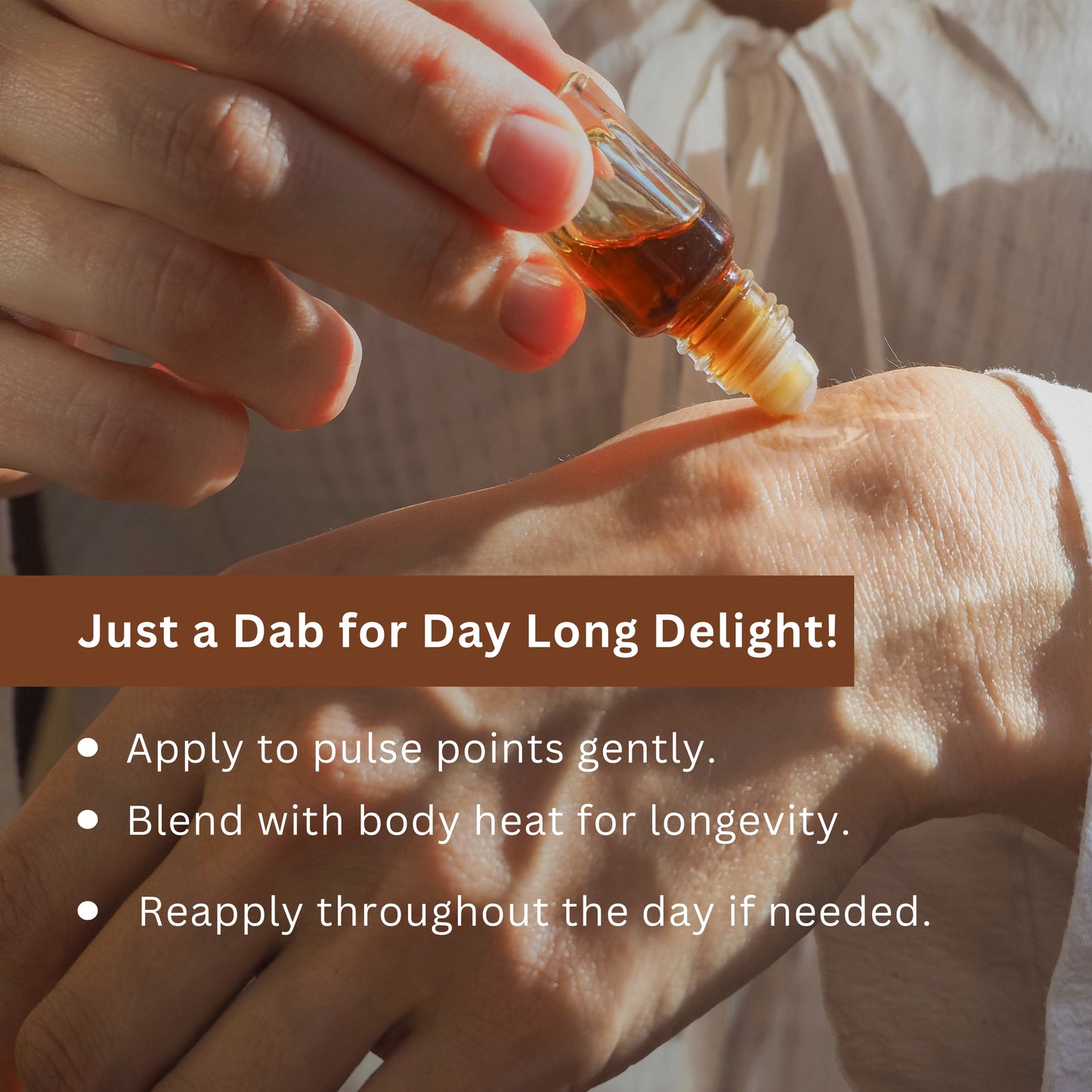 Tatha Mitti Attar with roller applicator held in hand, applying gently to pulse points — just a dab for day-long delight, blending with body heat for lasting fragrance.