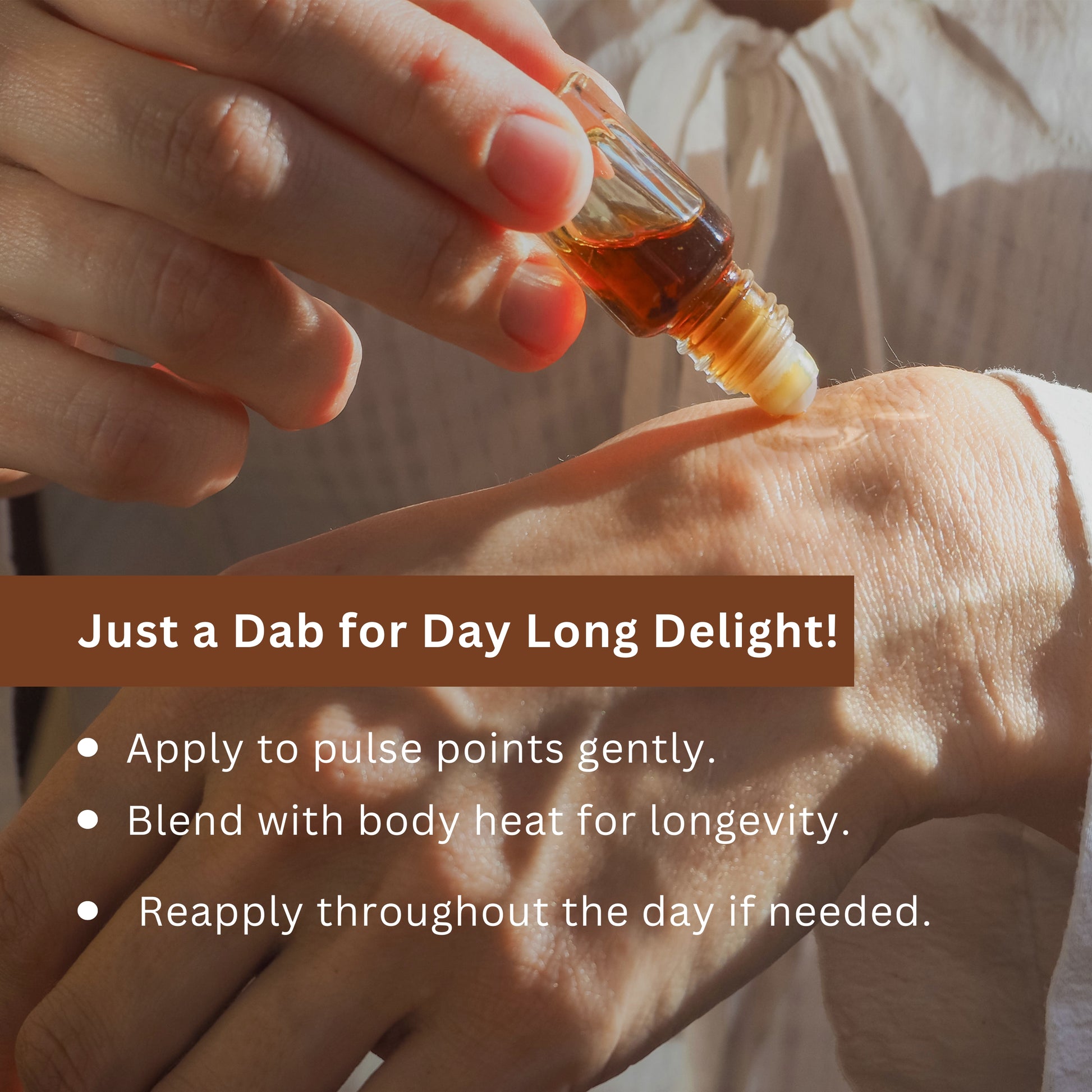 Tatha Mitti Attar with roller applicator held in hand, applying gently to pulse points — just a dab for day-long delight, blending with body heat for lasting fragrance.