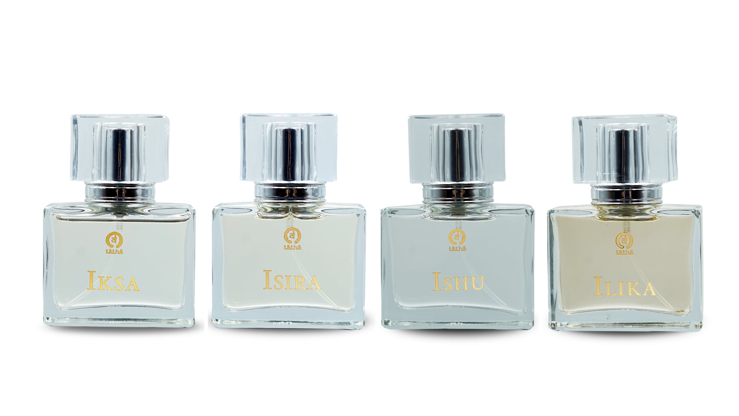 Tatha perfume collection featuring 32ml glass bottles: Tatha Ishu, Tatha Iksa, Tatha Isira, and Tatha Ilika, displayed without the box.