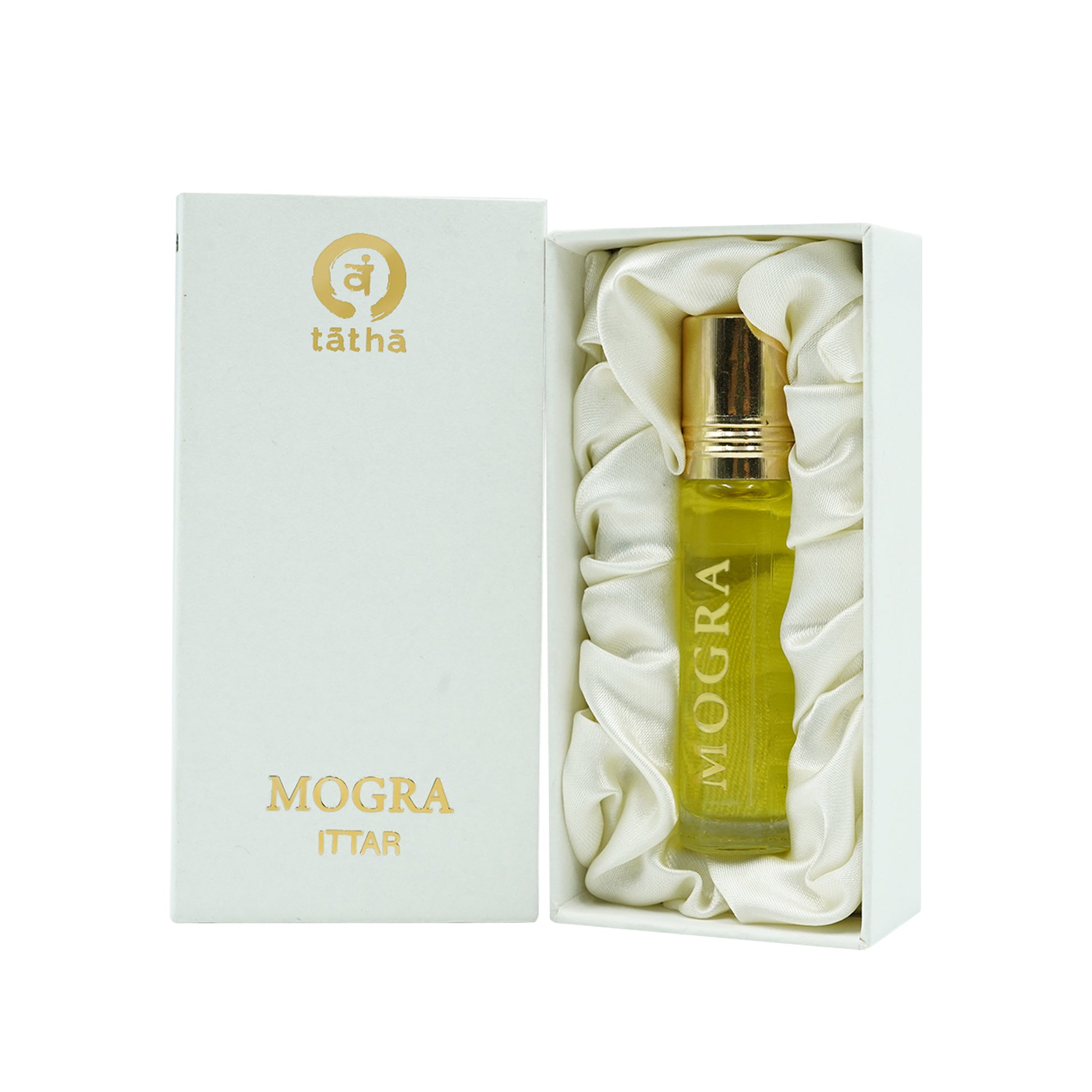 "Tatha Mogra Attar in a glass bottle with open box shown, and closed box placed inside.