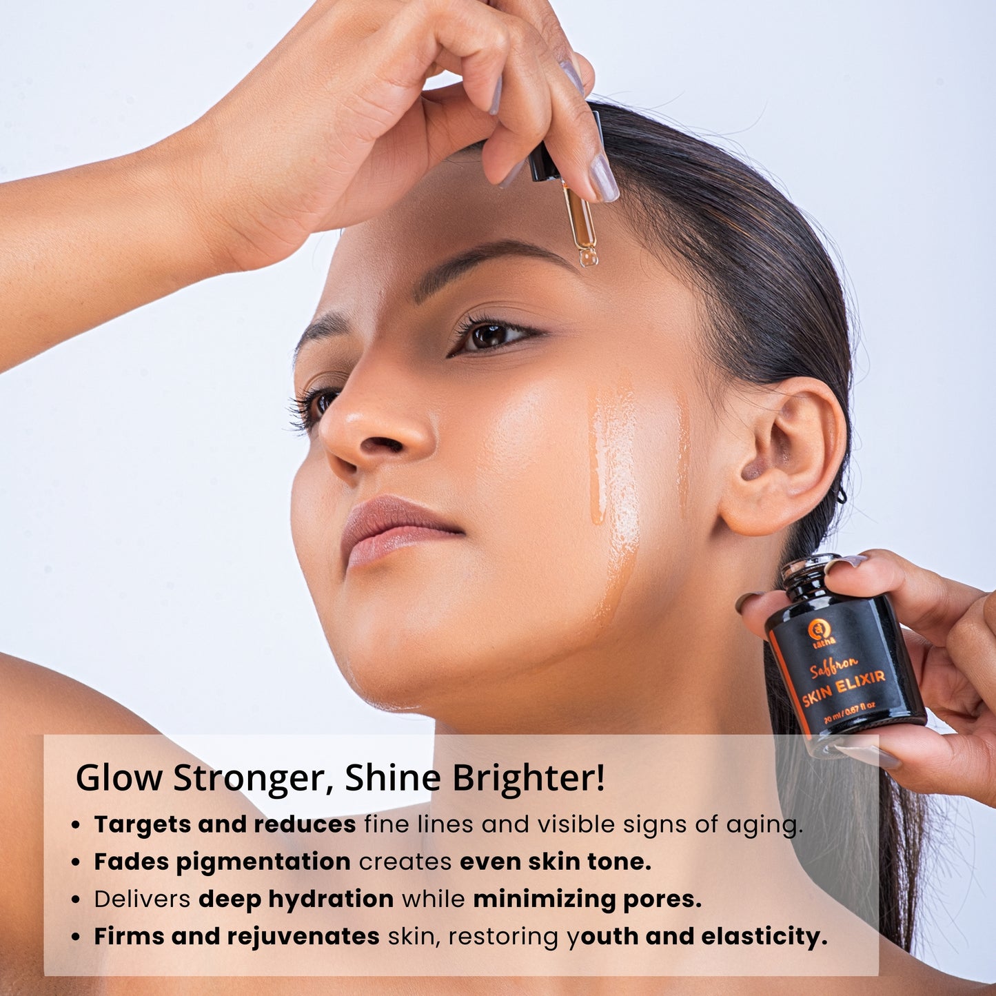 Tatha Saffron Skin Elixir applied by a woman using a dropper from a 20ml glass bottle – enhances glow and brightness, fades pigmentation, deeply hydrates, minimizes pores, firms and rejuvenates skin for youthful elasticity.